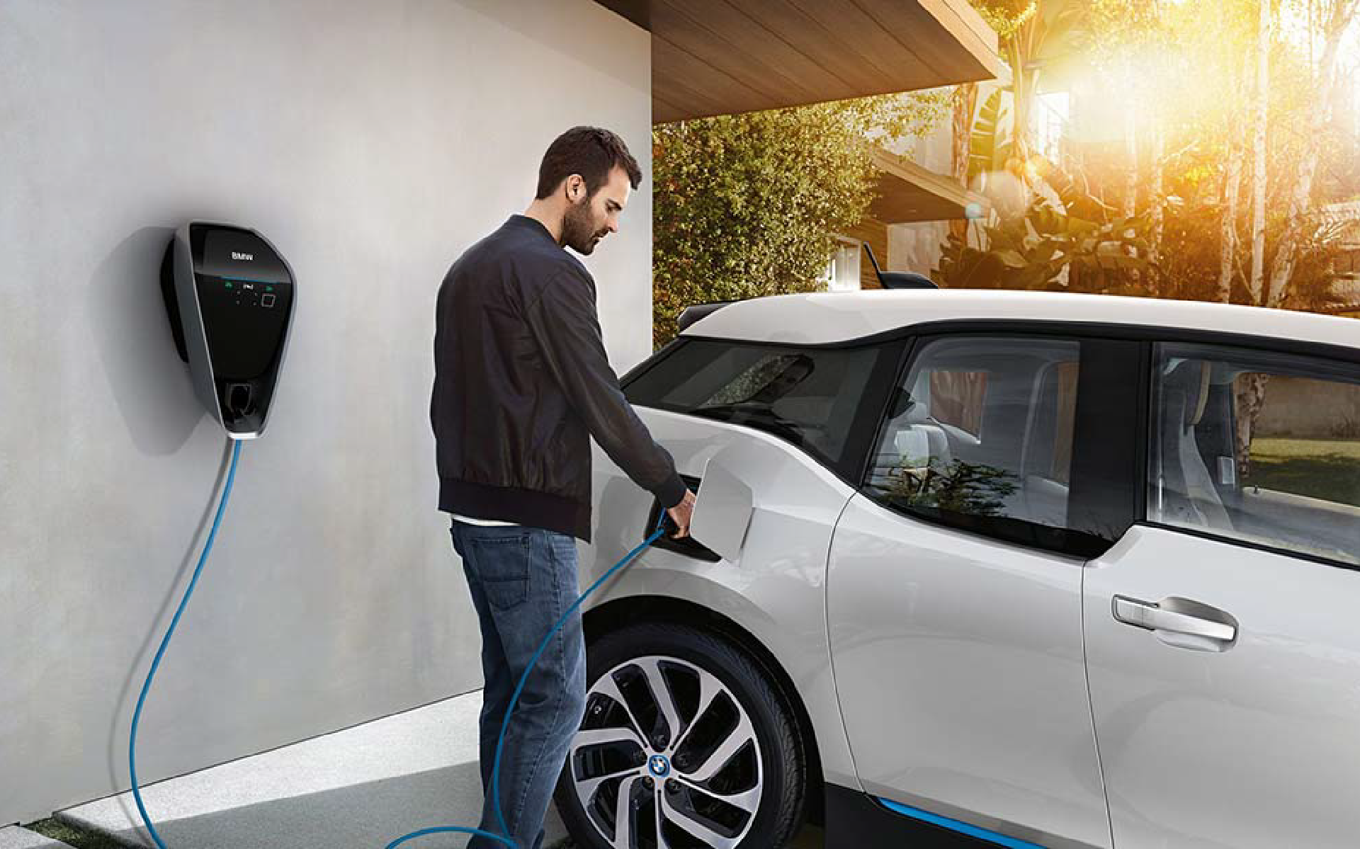 Man charging his electronic vehicle
